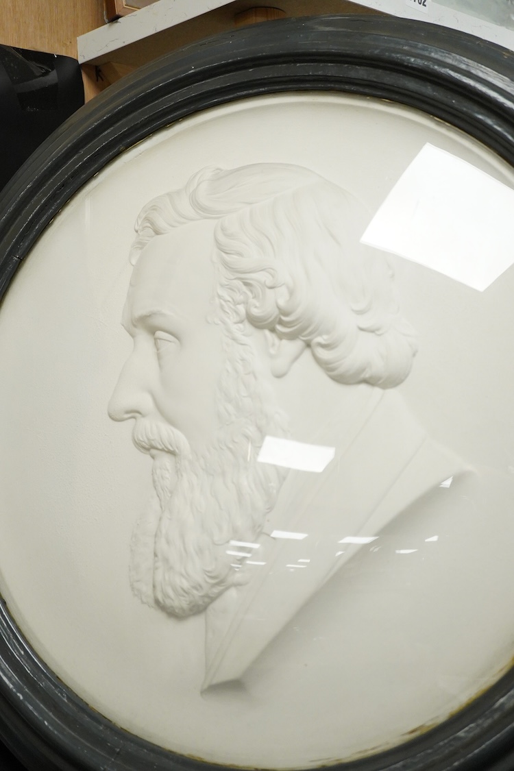 A large Victorian circular plaster portrait relief of a bearded gentleman, framed, 62cm in diameter